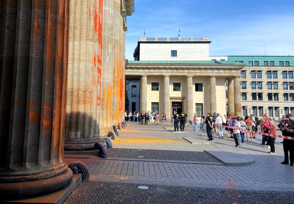 Brandenburg Gate in Berlin, Germany spray-painted by \"environmental groups\"