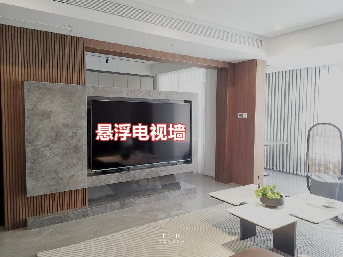 Remove the partition wall between the living room and the study room, and use a wall-mounted suspended TV wall as a partition to realize the interconnection and sharing of functional areas.